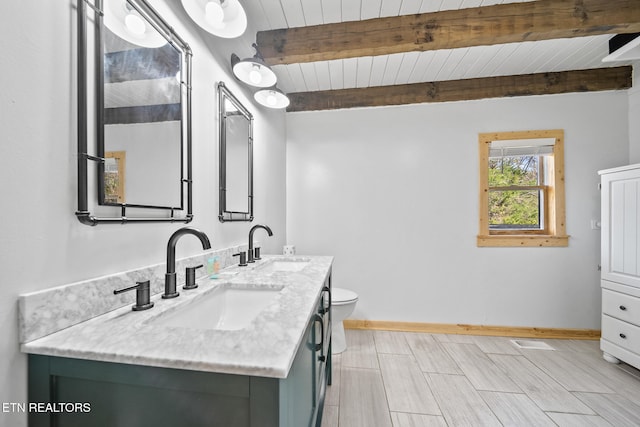 bathroom featuring vanity, beamed ceiling, toilet, and wooden ceiling