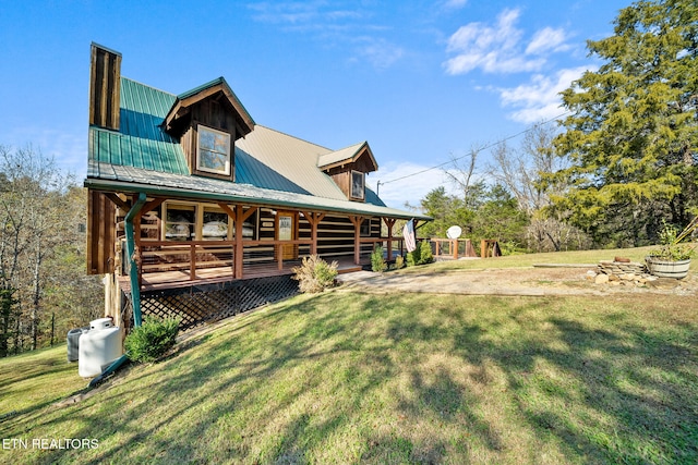 back of house with a lawn