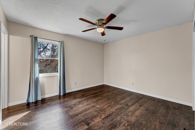 spare room featuring dark hardwood / wood-style floors, a textured ceiling, and ceiling fan