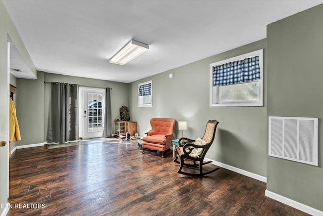 sitting room featuring dark hardwood / wood-style floors