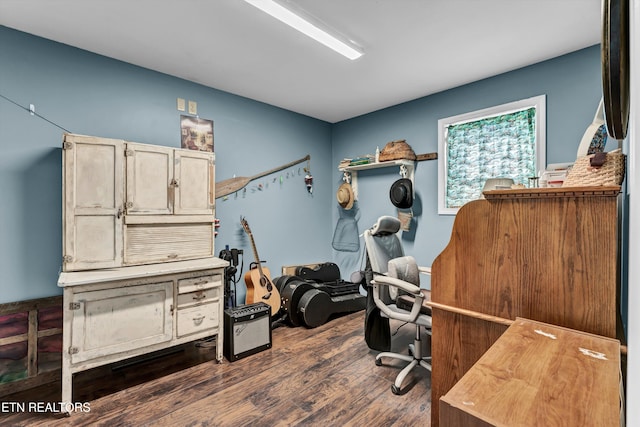 office with dark hardwood / wood-style flooring