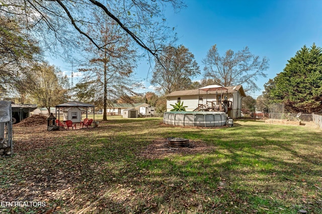 view of yard with a gazebo and a covered pool