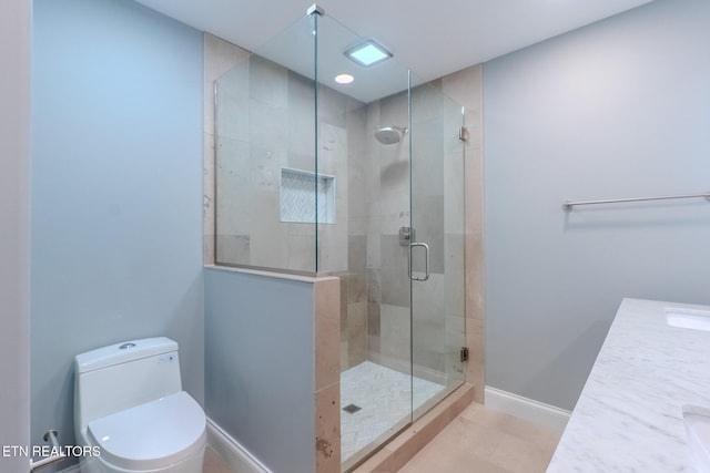 full bath with a shower stall, toilet, baseboards, and tile patterned flooring