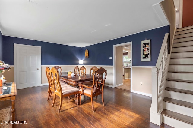 dining area with dark hardwood / wood-style floors