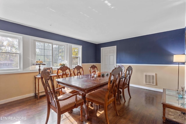 dining space featuring dark hardwood / wood-style flooring