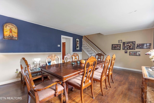 dining area featuring dark hardwood / wood-style flooring