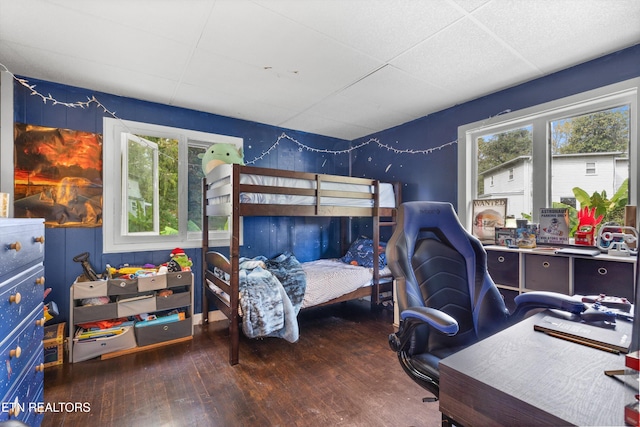 bedroom with wood-type flooring