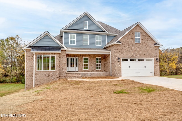 craftsman inspired home featuring covered porch and a garage