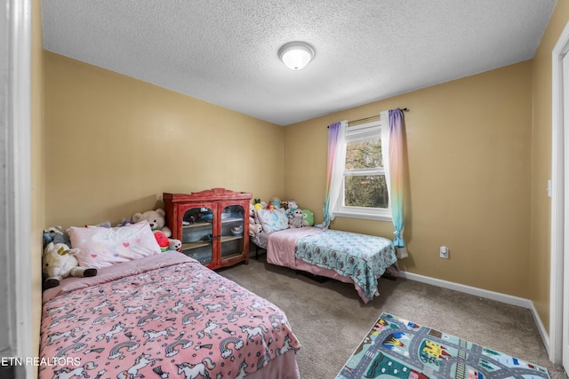 carpeted bedroom with a textured ceiling