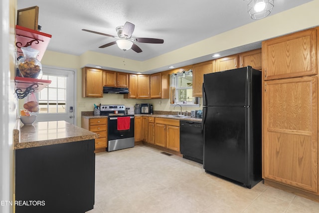 kitchen featuring black appliances, sink, and ceiling fan