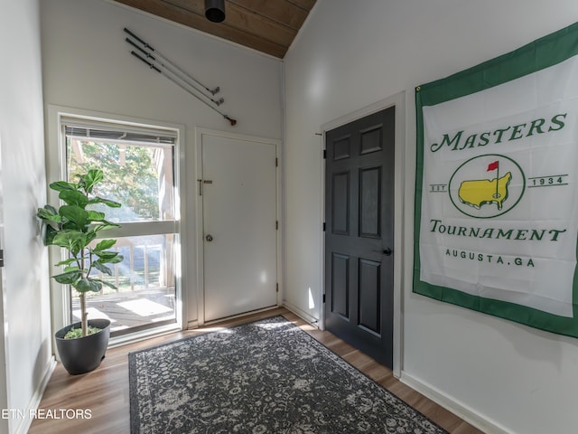 foyer entrance with lofted ceiling, hardwood / wood-style floors, and wooden ceiling