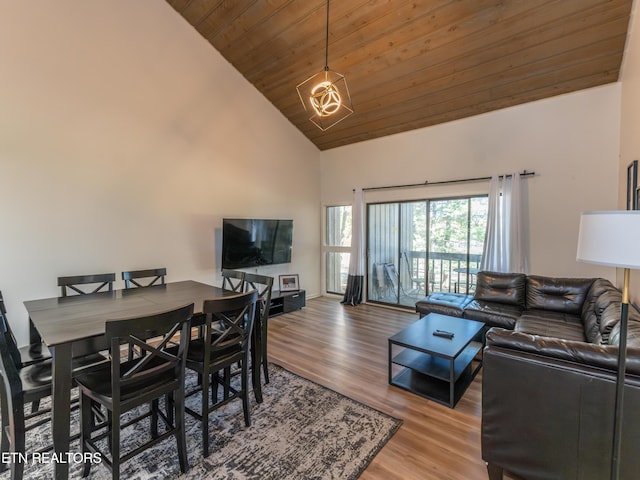 living room with wood ceiling, hardwood / wood-style flooring, and high vaulted ceiling