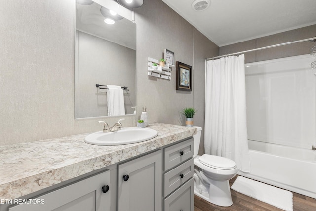 full bathroom with vanity, toilet, hardwood / wood-style flooring, and shower / bathtub combination with curtain