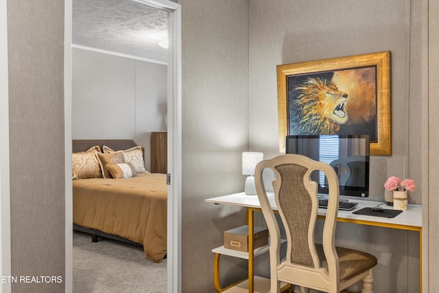 carpeted bedroom featuring ornamental molding and a textured ceiling