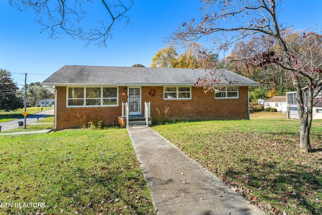 view of front of property with a front lawn