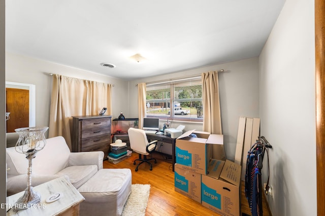 office with wood-type flooring