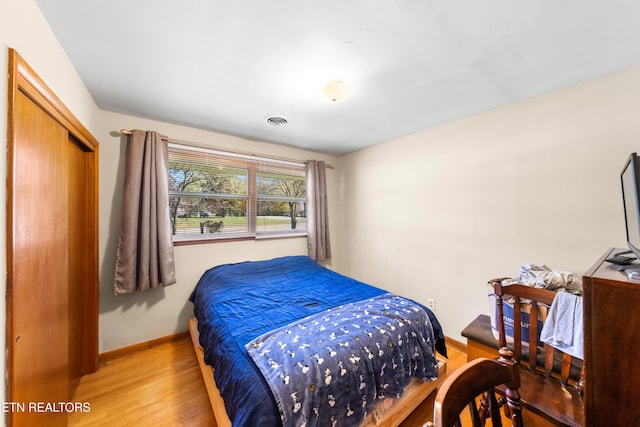 bedroom featuring a closet and hardwood / wood-style floors