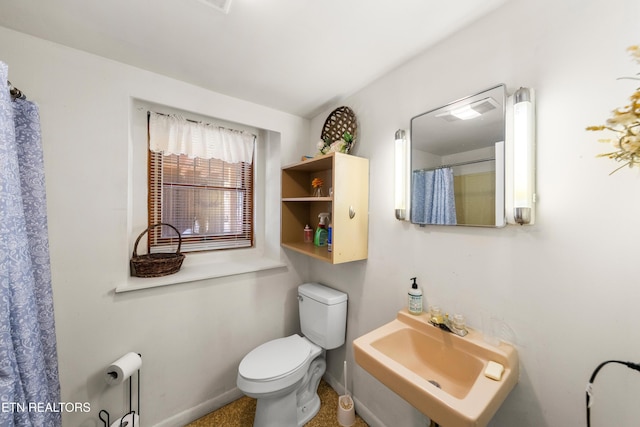 bathroom with sink and toilet