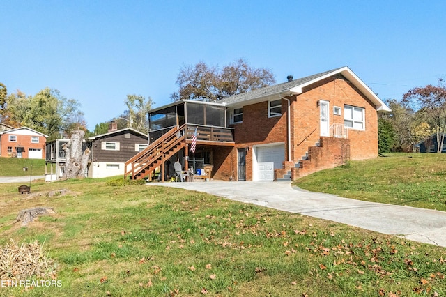 exterior space with a lawn, a sunroom, and a garage