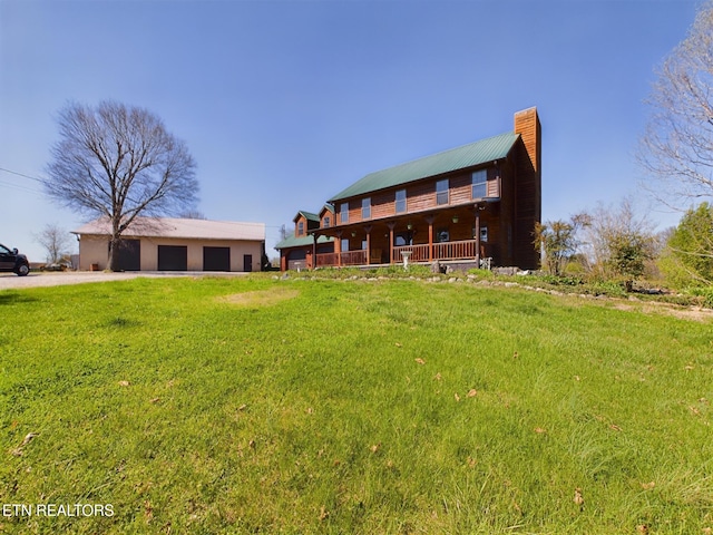 back of house featuring a yard