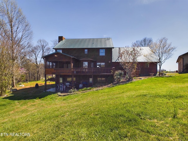 rear view of house with a yard and a patio area