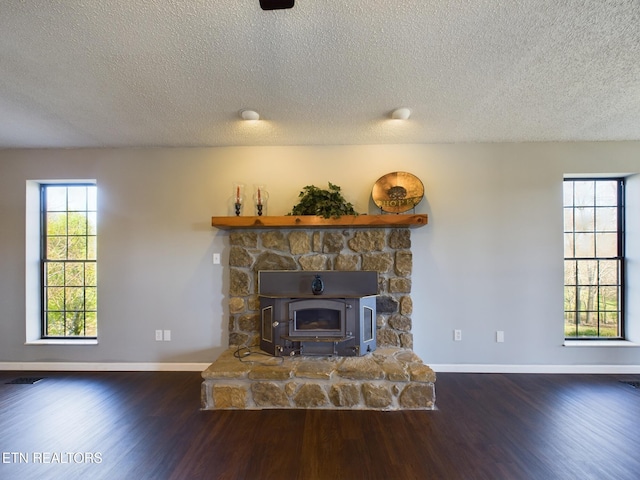 living room featuring dark hardwood / wood-style floors and a textured ceiling