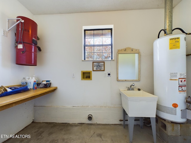 interior space featuring hookup for a washing machine, hookup for an electric dryer, and gas water heater