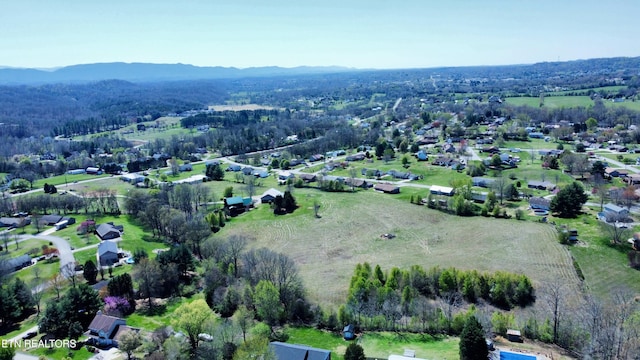 birds eye view of property featuring a mountain view