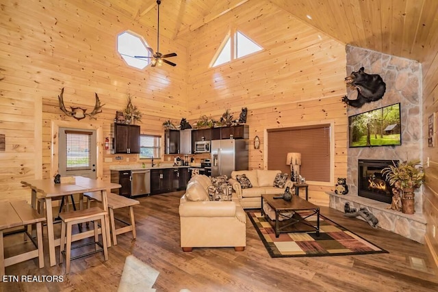 living room featuring high vaulted ceiling, wooden ceiling, wood-type flooring, and ceiling fan