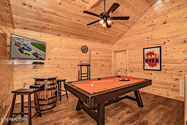 recreation room featuring hardwood / wood-style flooring, lofted ceiling, and wooden walls