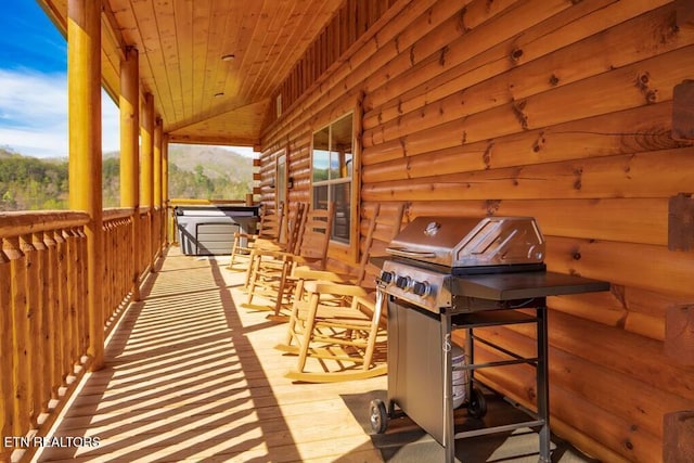 wooden deck featuring grilling area