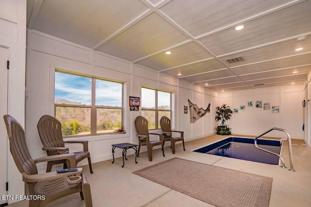 view of pool with a hot tub