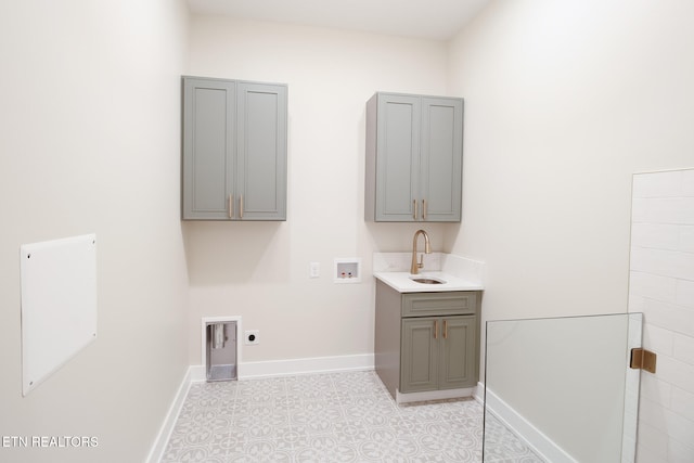 laundry area with hookup for a washing machine, sink, cabinets, and hookup for an electric dryer