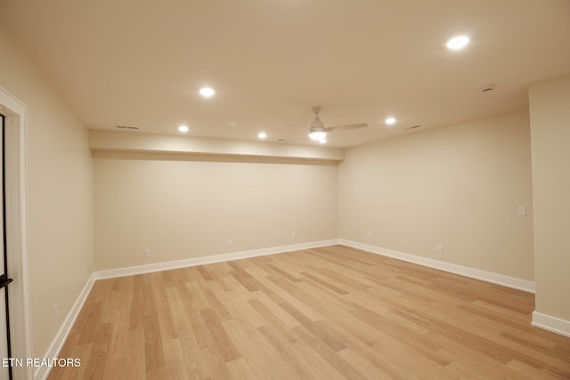 unfurnished room featuring ceiling fan and light wood-type flooring