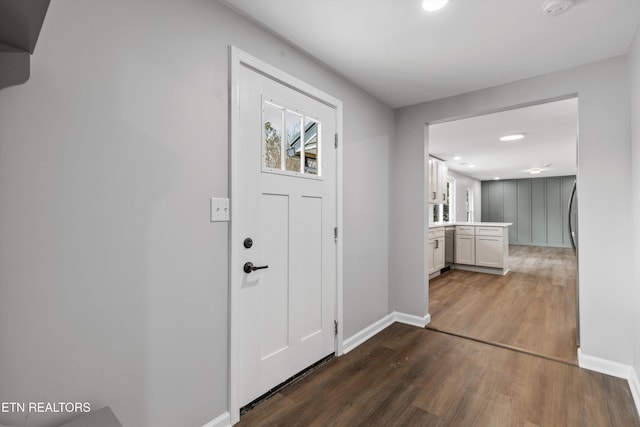 entryway with dark hardwood / wood-style floors