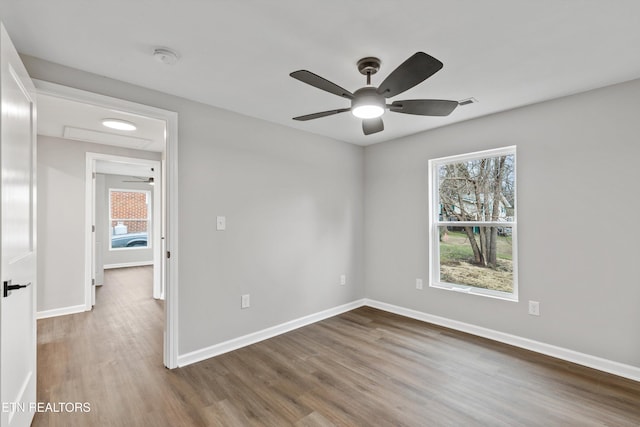 unfurnished room featuring hardwood / wood-style flooring and ceiling fan