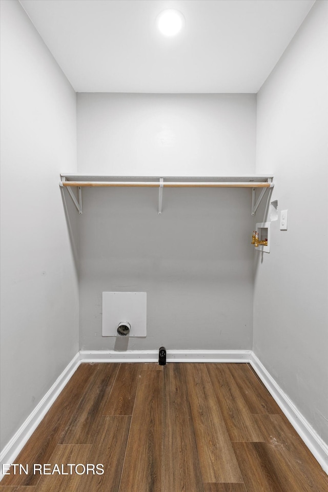 clothes washing area with washer hookup and dark wood-type flooring