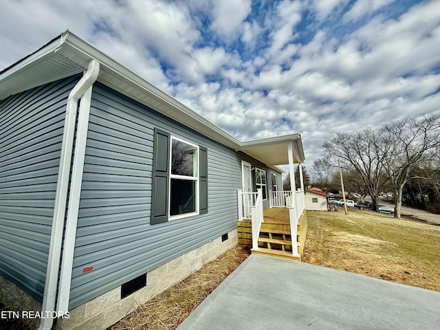 view of property exterior with a yard