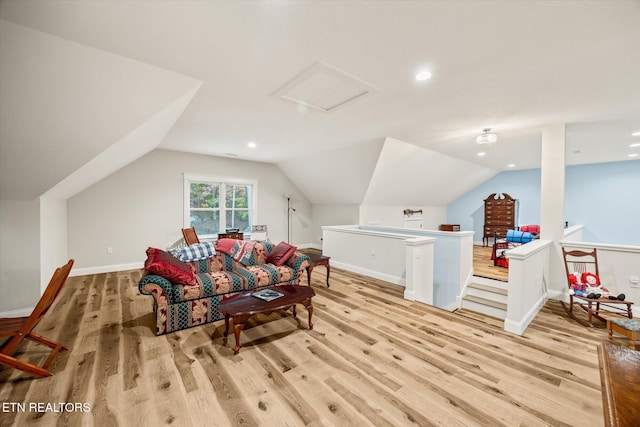 interior space with lofted ceiling and light hardwood / wood-style floors