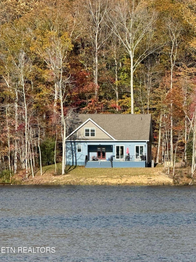 view of front of house featuring a water view