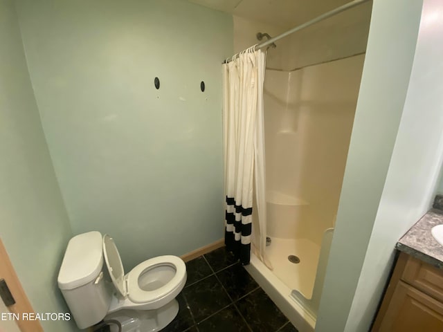 bathroom with toilet, vanity, a shower with shower curtain, and tile patterned flooring