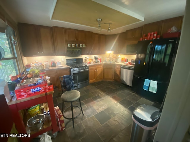 kitchen with black appliances and sink