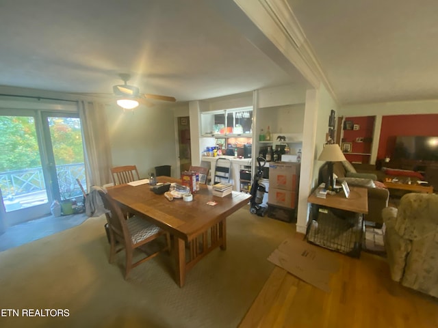 dining room with light hardwood / wood-style flooring, ceiling fan, and crown molding