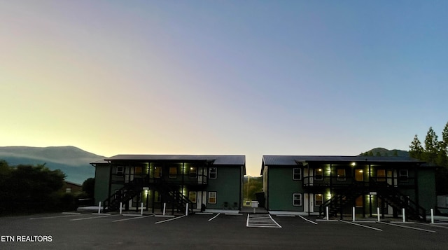 outdoor building at dusk featuring a mountain view