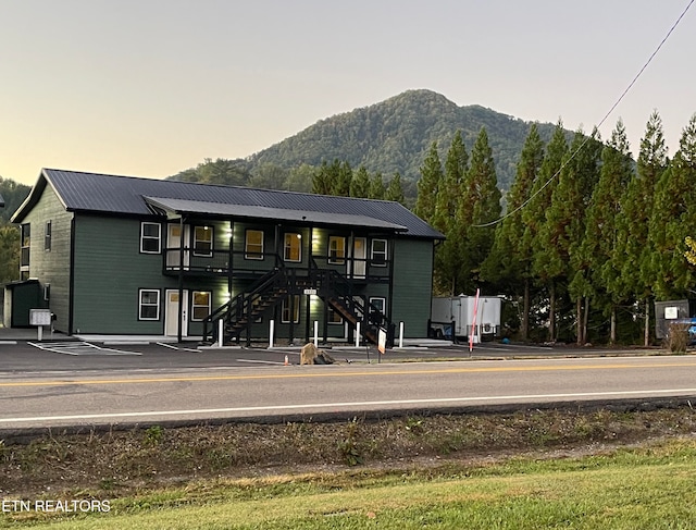 outdoor building at dusk featuring a mountain view