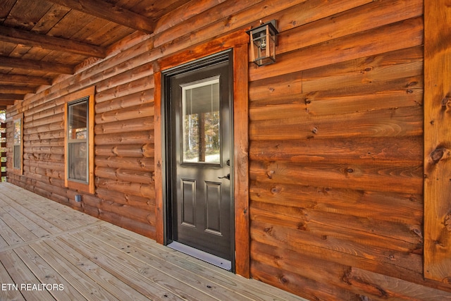 property entrance with a deck