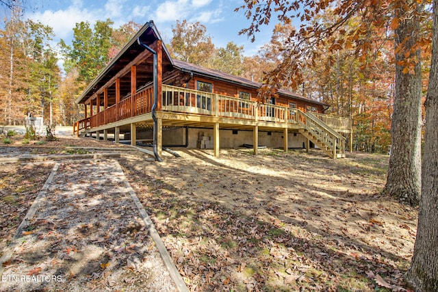 back of house featuring a deck