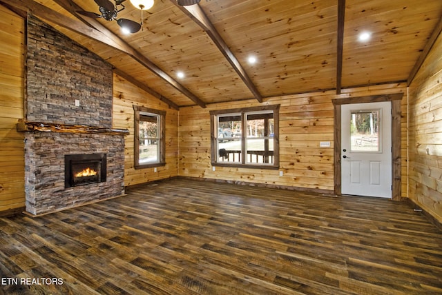 unfurnished living room featuring vaulted ceiling with beams, dark hardwood / wood-style floors, and wood walls