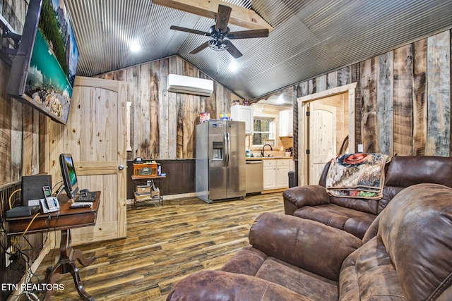 living room featuring wood walls, an AC wall unit, ceiling fan, lofted ceiling, and hardwood / wood-style flooring