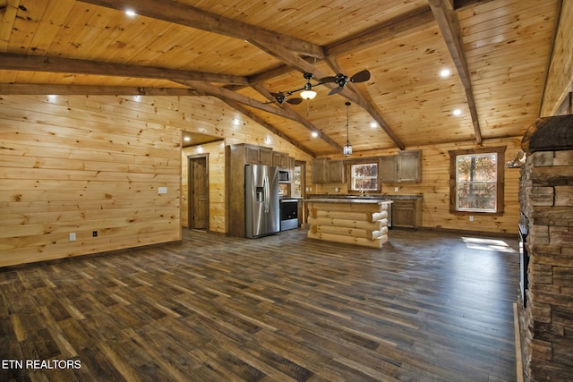 unfurnished living room with lofted ceiling with beams, dark hardwood / wood-style flooring, and wooden walls